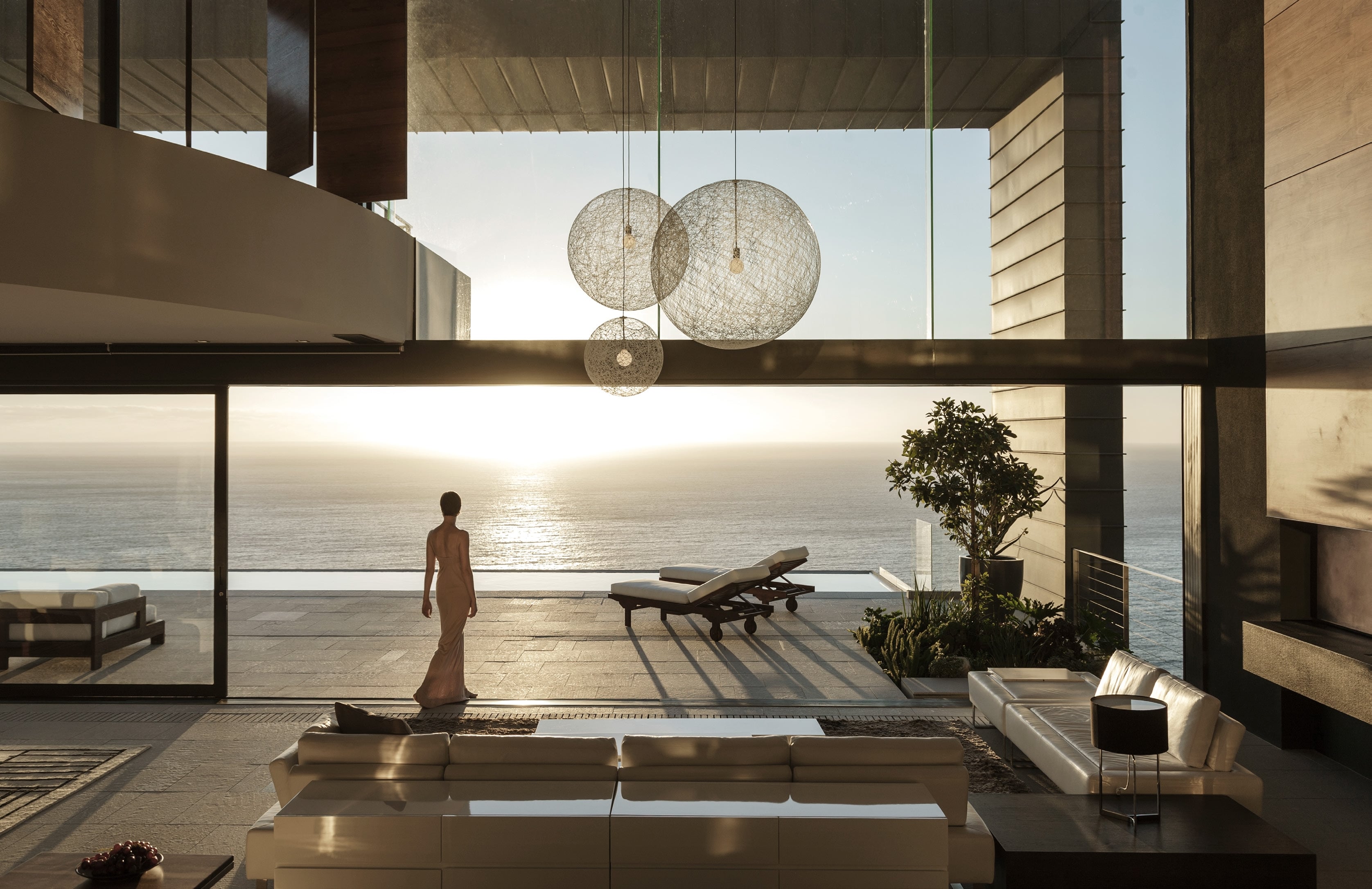 Rooftop infinity pool overlooking the ocean at sunset